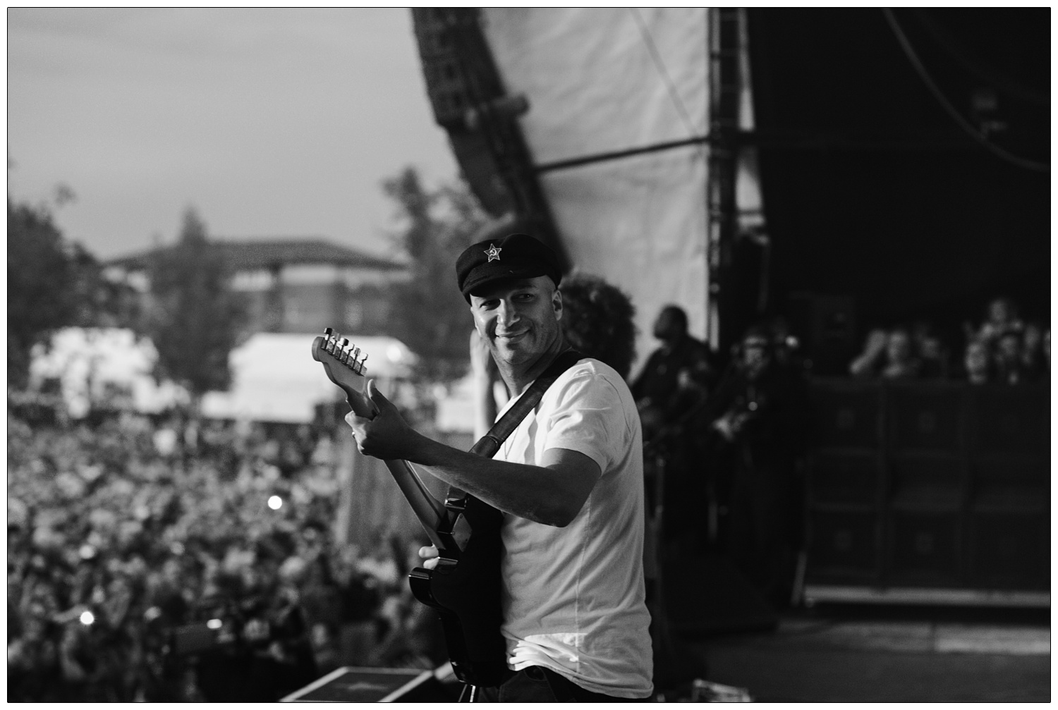 Tom Morello smiling at Rage Against the Machine gig in 2010.