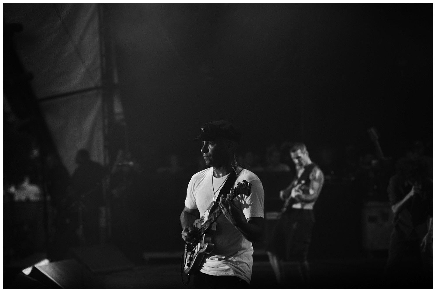 Tom Morello playing the Arm the Homeless guitar at the Finsbury Park gig, Timmy C in the background on bass