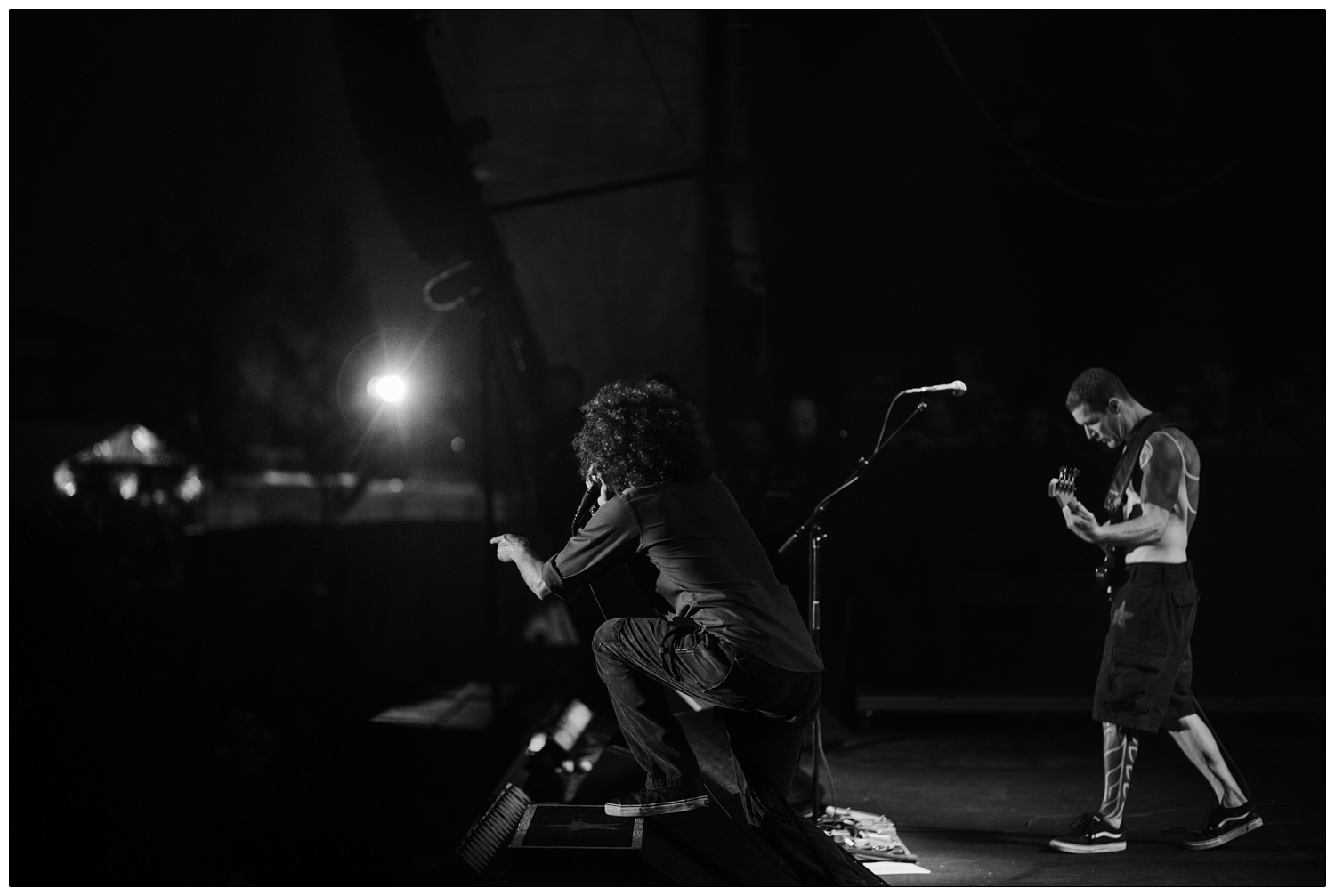 Black and white photo of Zack and Tim of Rage Against the Machine performing in Finsbury Park in 2010