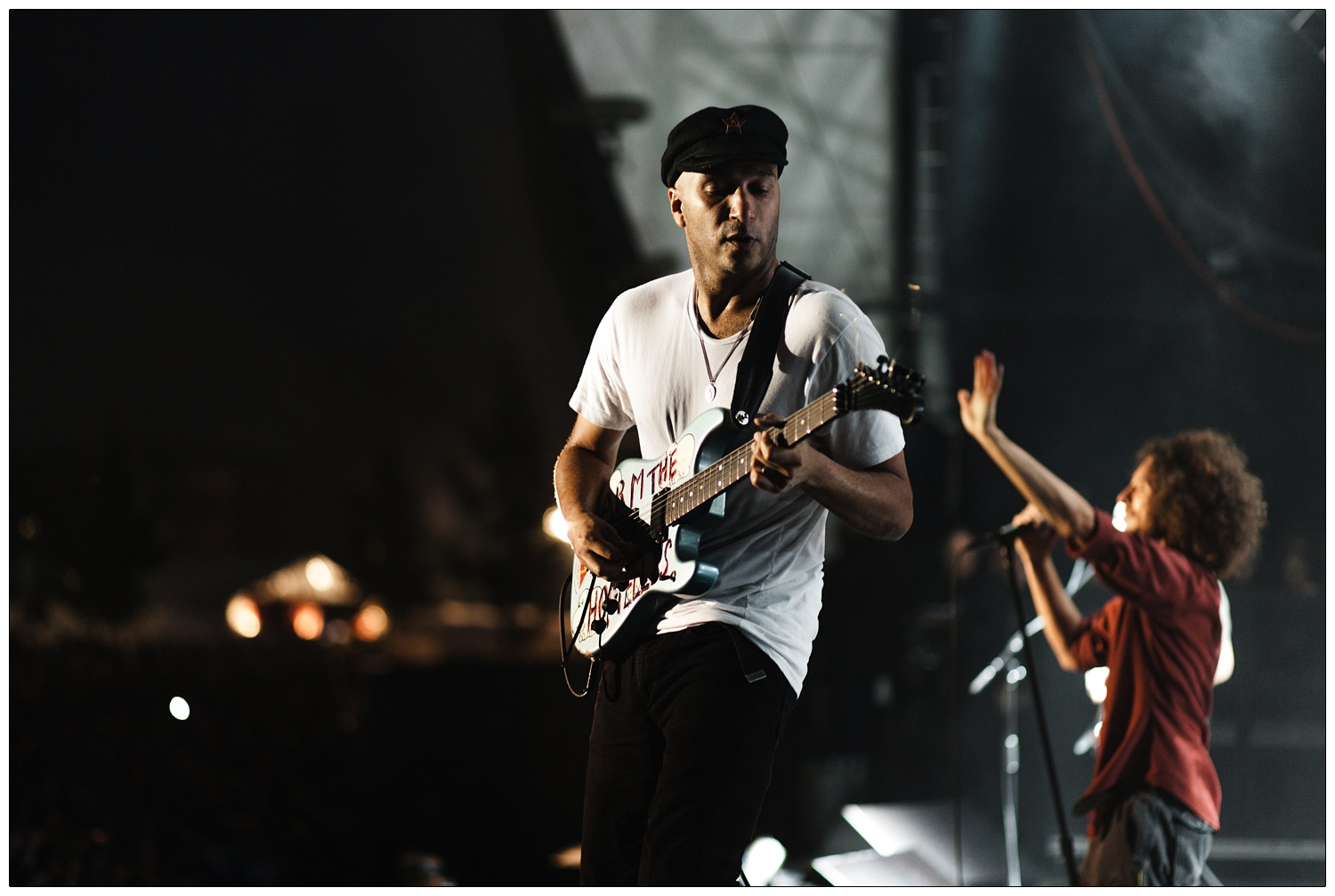 Photograph of Tom Morello playing Arm the Homeless guitar on stage, Zack de la Rocha is behind him. From the Killing in the Name Christmas number one gig in Finsbury Park.