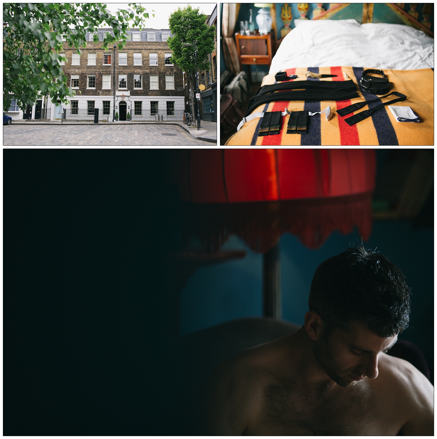 A man with no top on is in a room with a red lamp and blue walls.