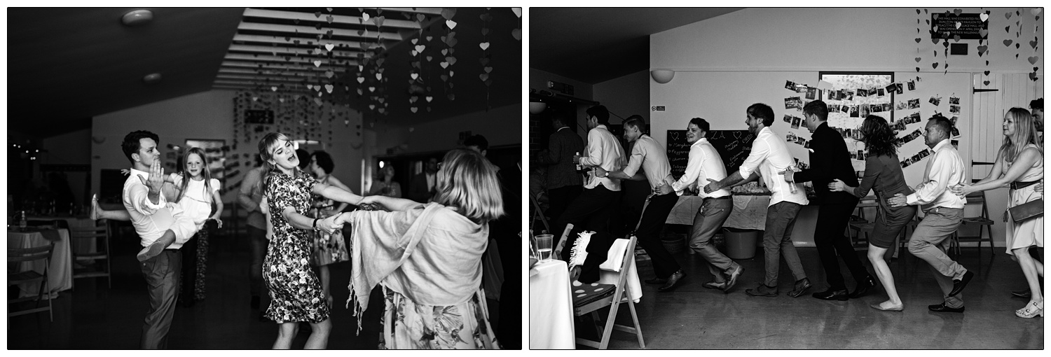 People at a wedding reception doing the conga.