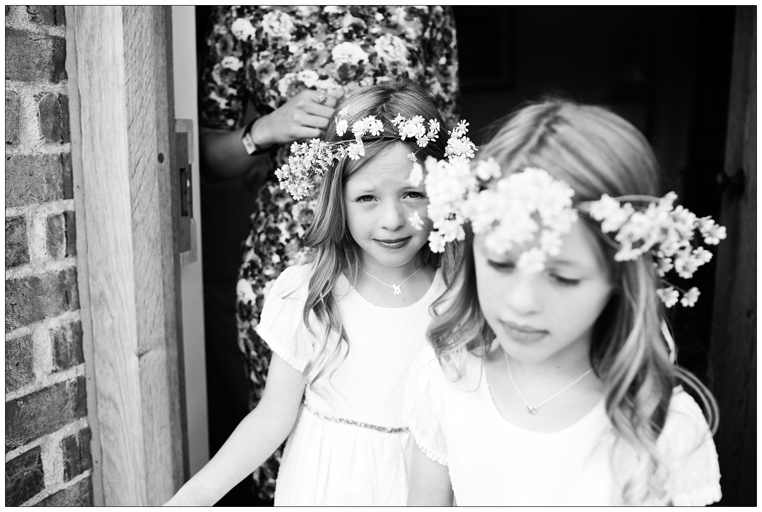 Bridesmaids in a doorway.