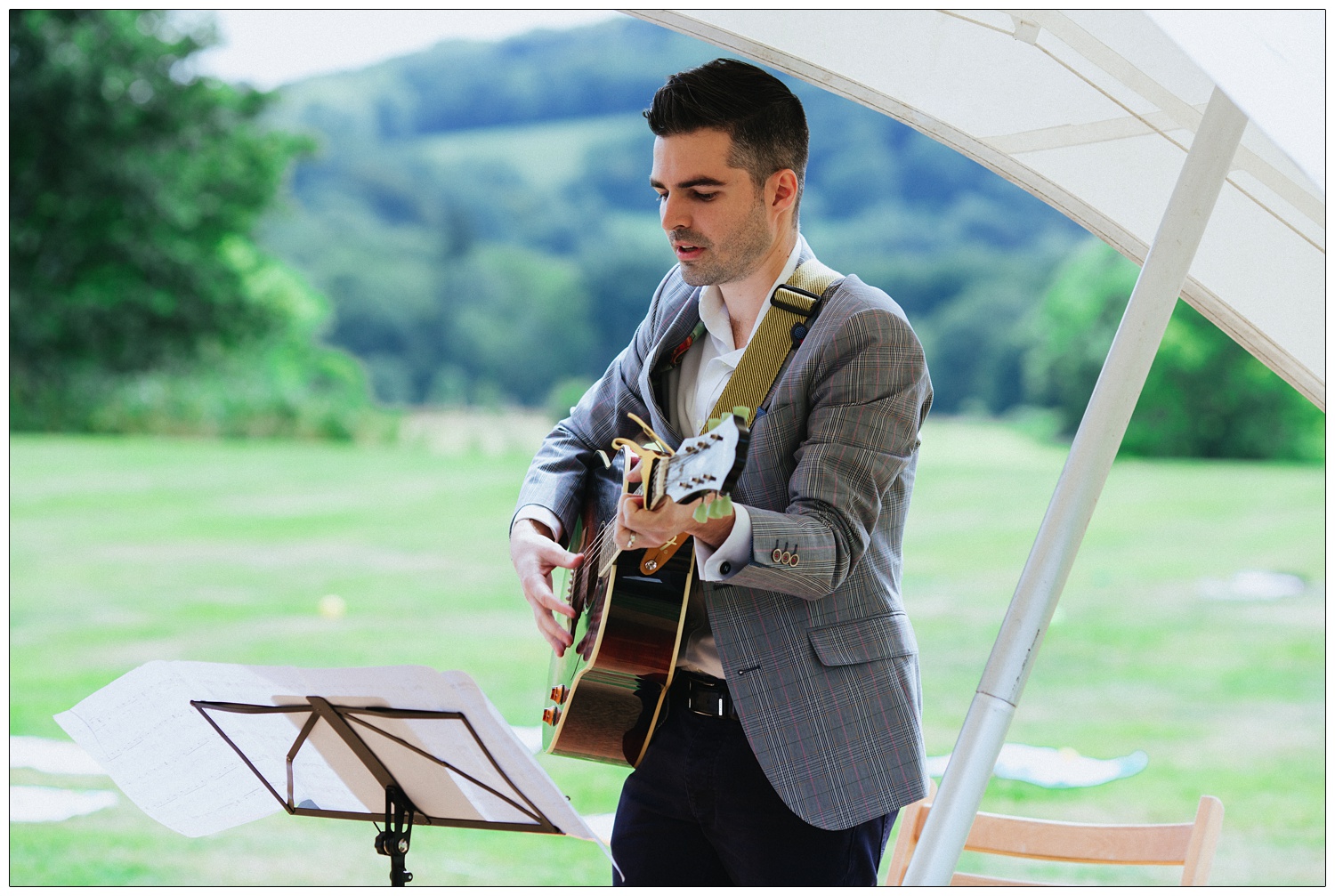 Nathan of The Boxer Rebellion plays a song at a friend's wedding ceremony.
