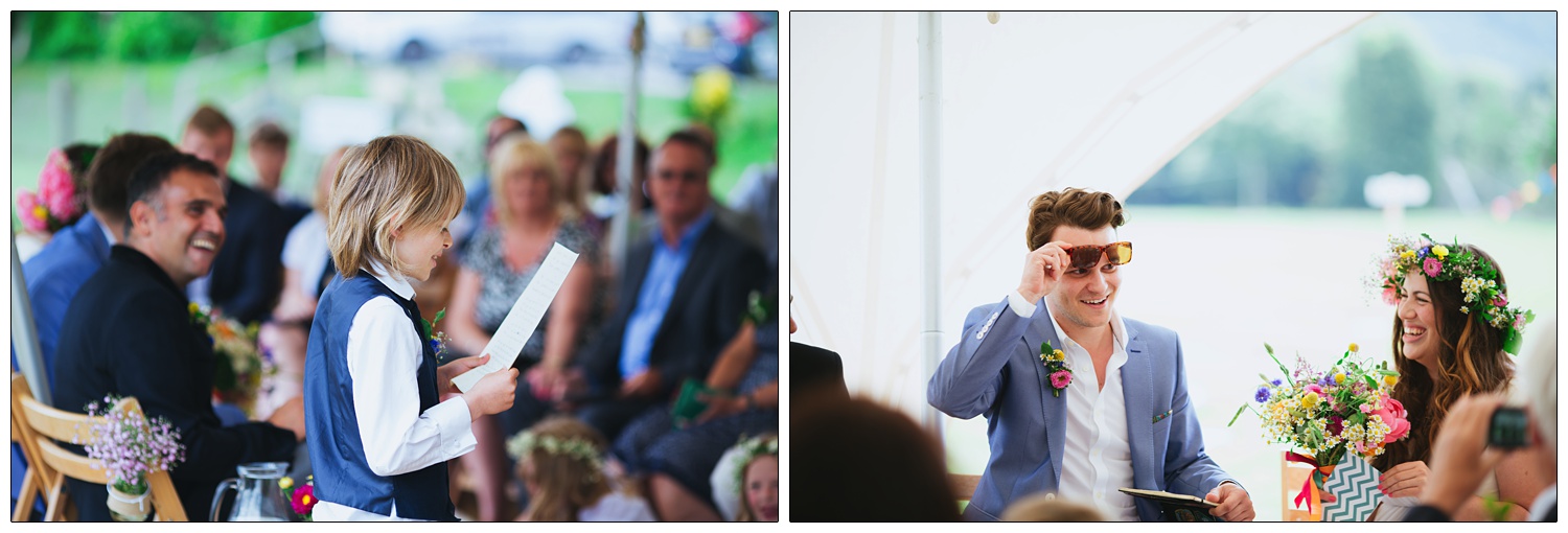 A small boy gives a speech at a wedding ceremony outside.