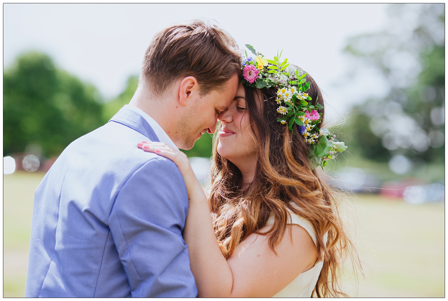 The bride and groom are close together.