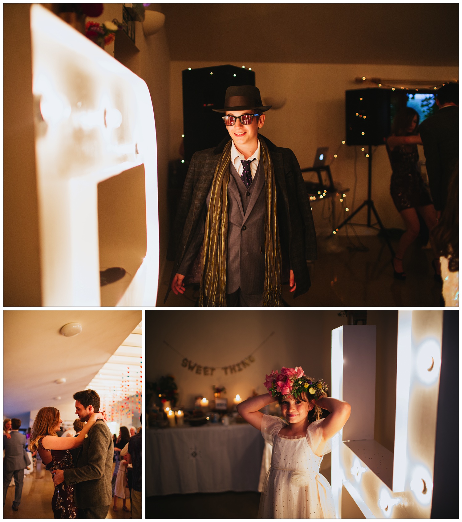 A boy in a hat, scarf and jacket walks past illuminated letters. A girl tries on a floral hat.