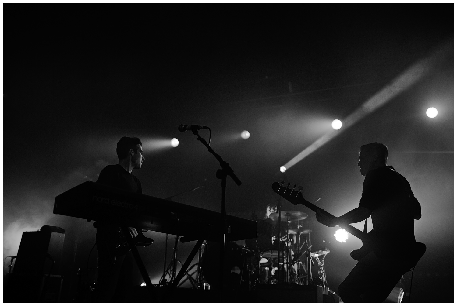 Black and white photograph of Nathan Nicholson and Adam Harrison performing at The Boxer Rebellion gig at The Forum in 2013