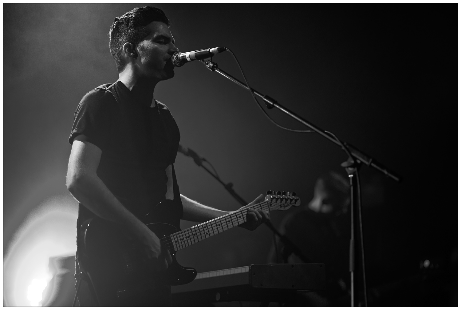 Black and white photograph of Nathan Nicholson performing at The Boxer Rebellion gig at The Forum in 2013