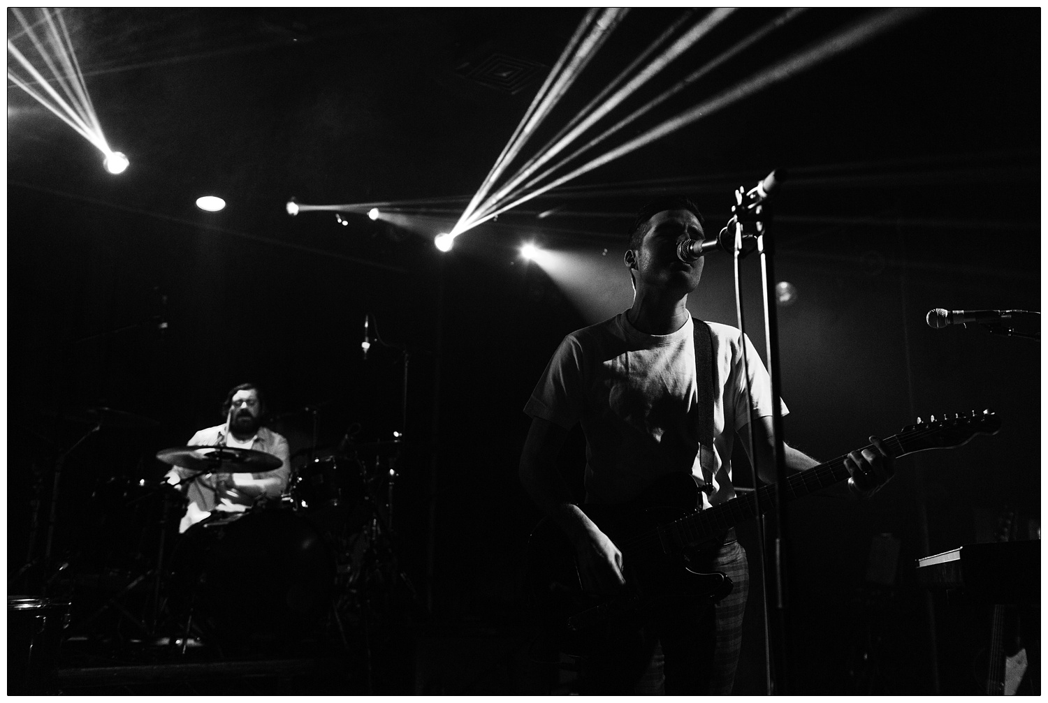 Black and white photograph of Nathan Nicholson and Piers Hewitt performing in The Boxer Rebellion at the Scala in 2014