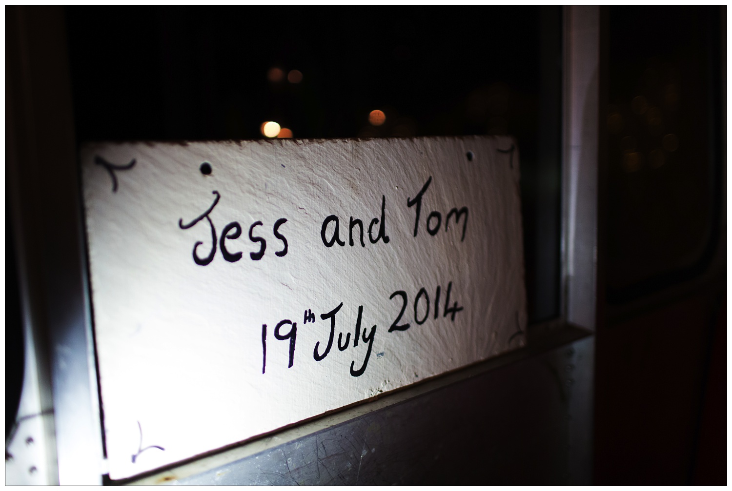 A sign saying "Jess and Tom 19th July 2014".
