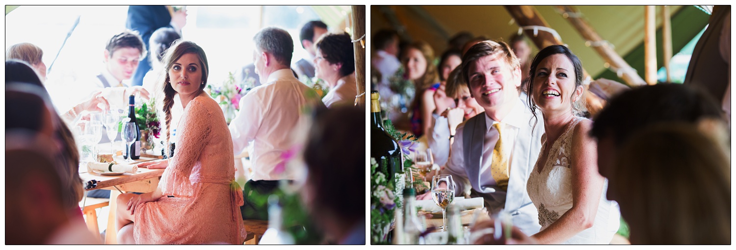 Bride is laughing and looking up at her father giving a speech. Her sister is sat on a bench.