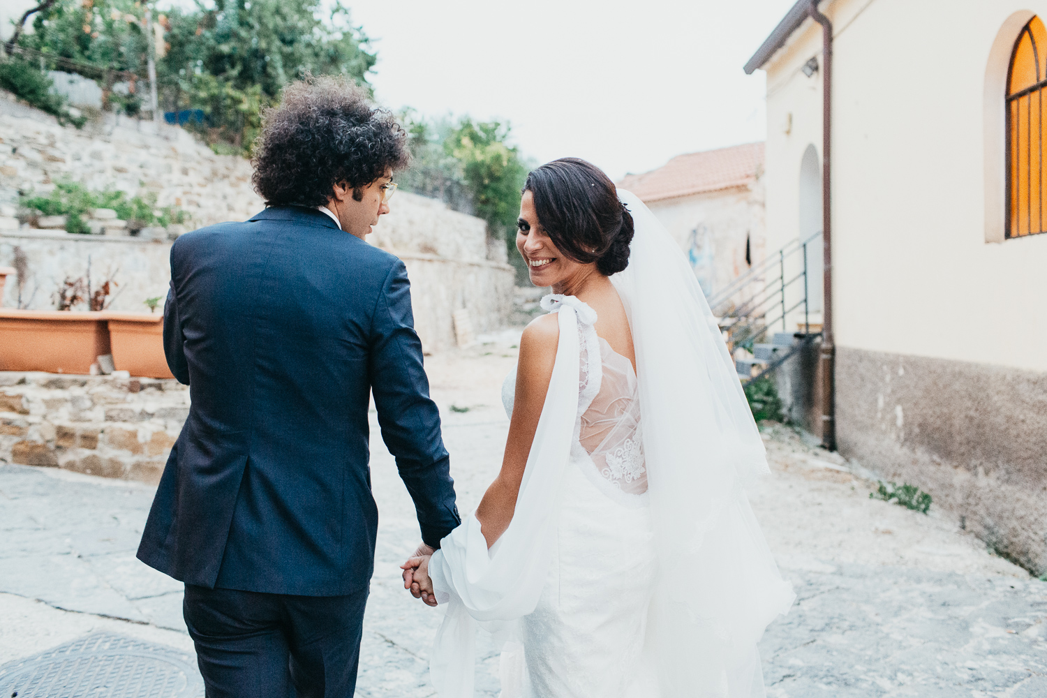 bride and groom walking along after Italian wedding