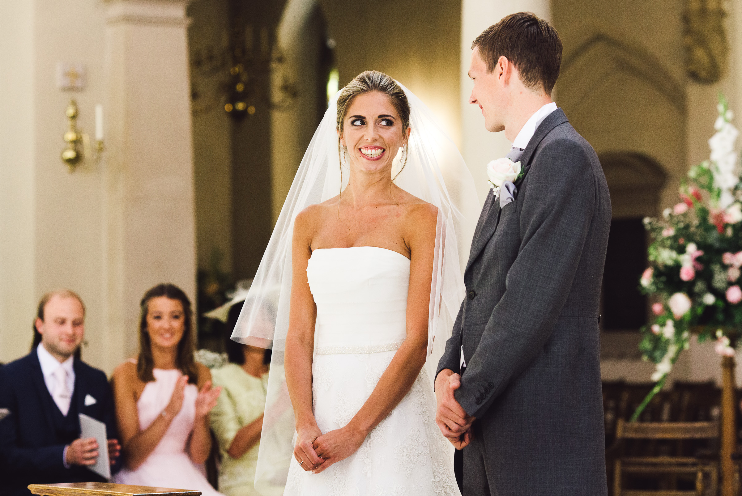 Bride smiling at groom at Brentwood Cathedral wedding