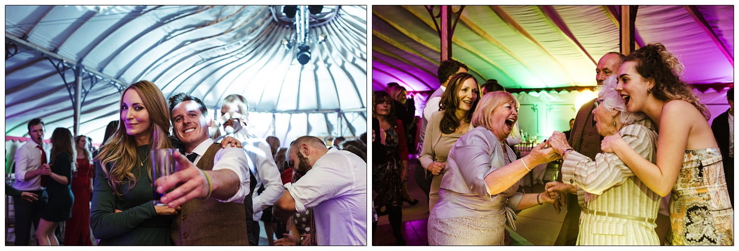 Women are hugging and laughing together at a wedding reception.