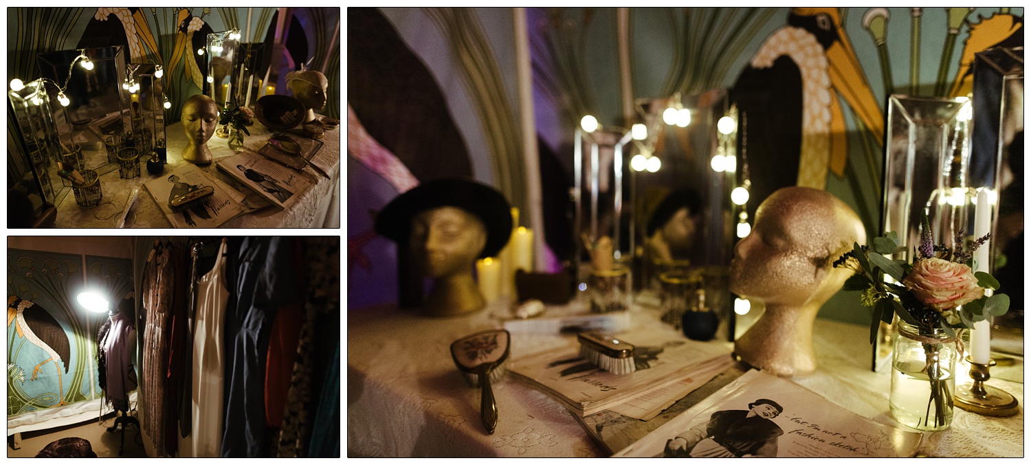 A dressing table at a wedding. There are vintage hair brushes, mirrors and magazines.