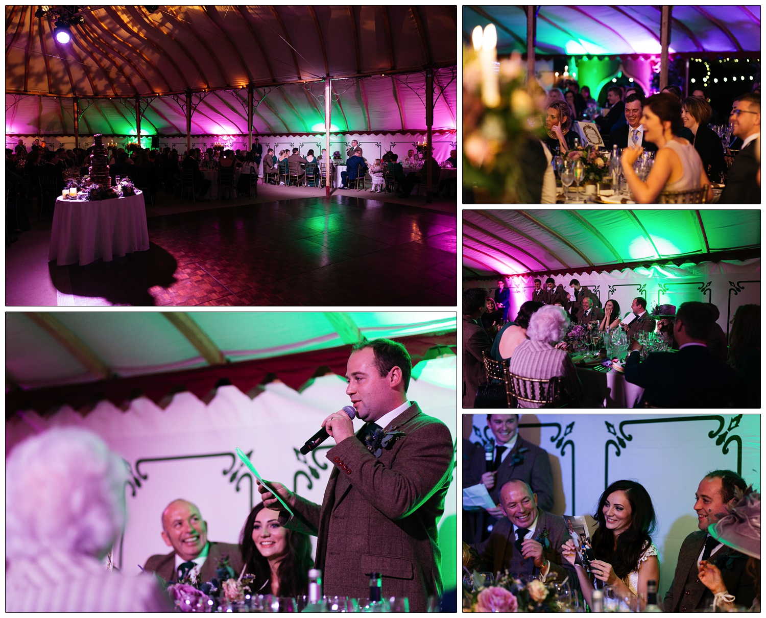 The groom gives a speech. There is a spotlight on the top table and the rest of the room is lit up in magenta and green. The bride holds up an embarrassing photograph of her new husband.