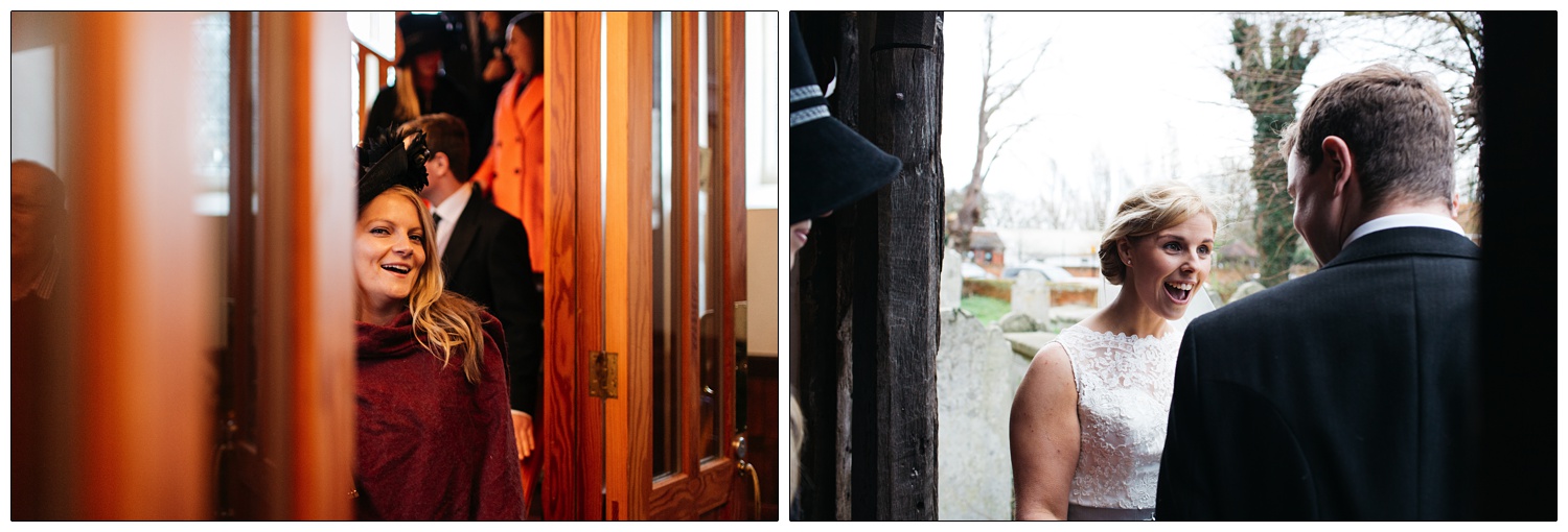 A woman in a doorway with a red shawl and black hat. Bride with a surprised happy face.