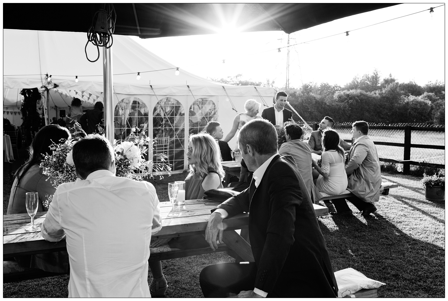 wedding guests sat at picnic table