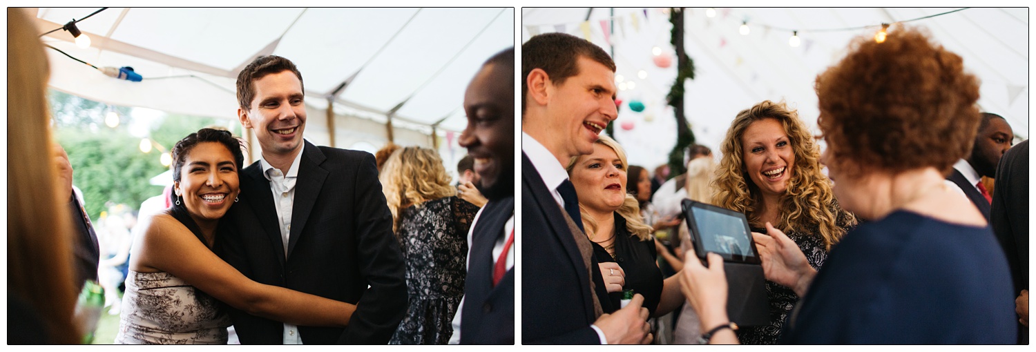 A woman hugging a man in a marquee.