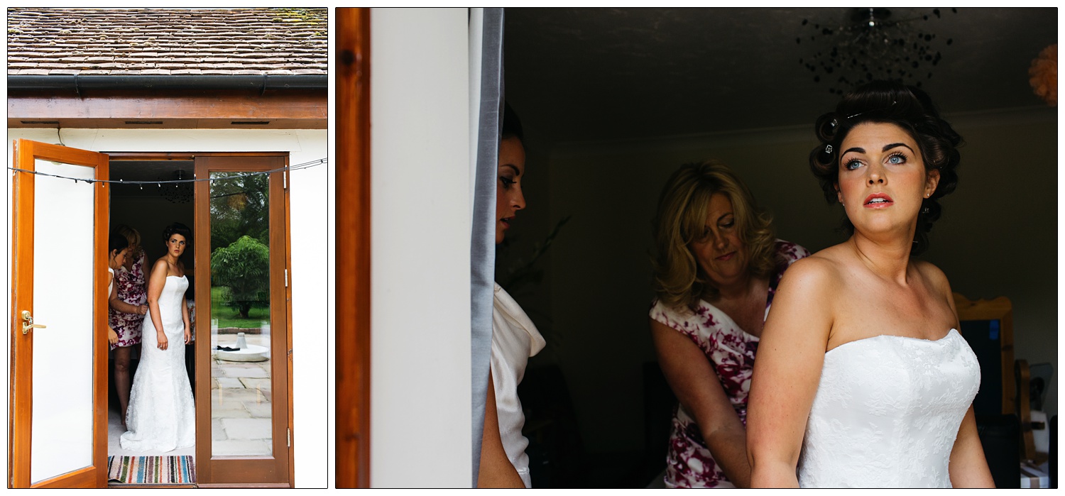 woman in rollers and wedding dress getting ready and looking out of the door