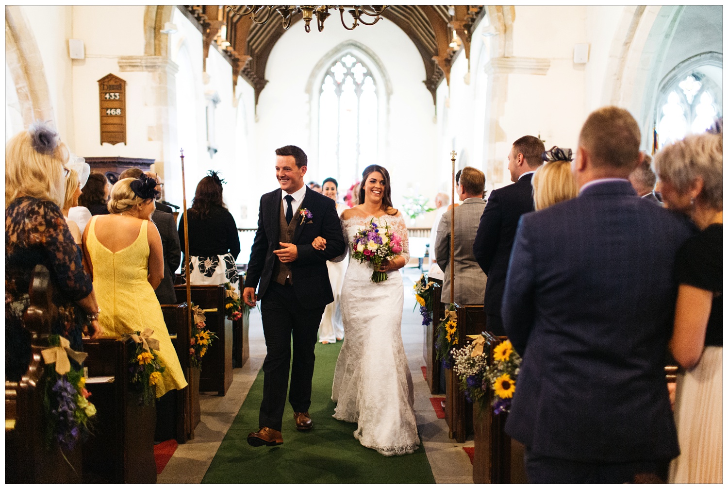 bride and groom walking down the aisle