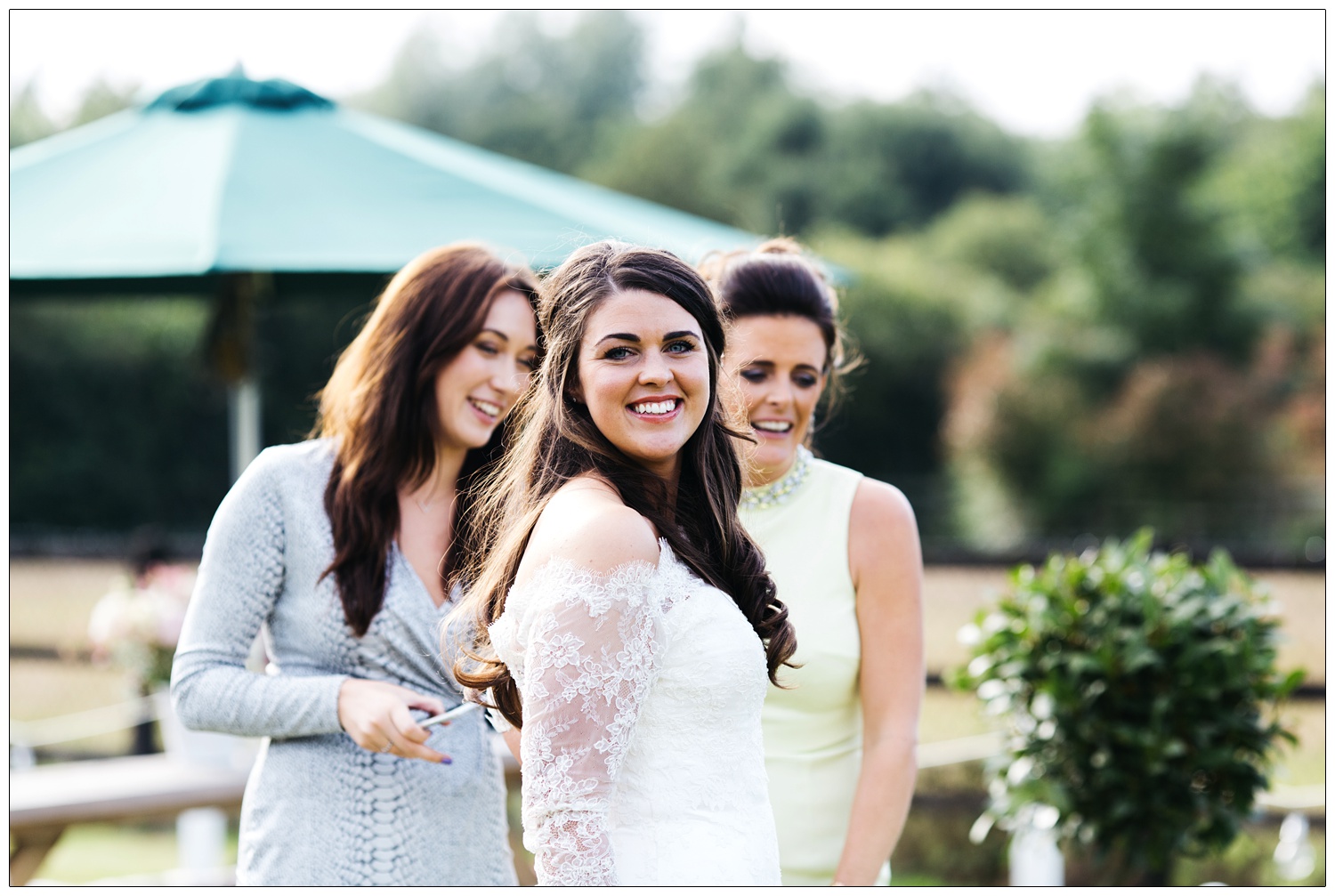 newly married woman in wedding dress looking at camera outside