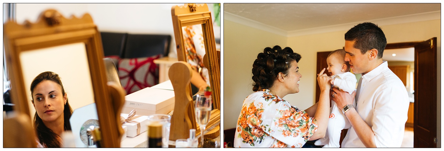 Woman in mirror. Woman bopping a baby on the nose.