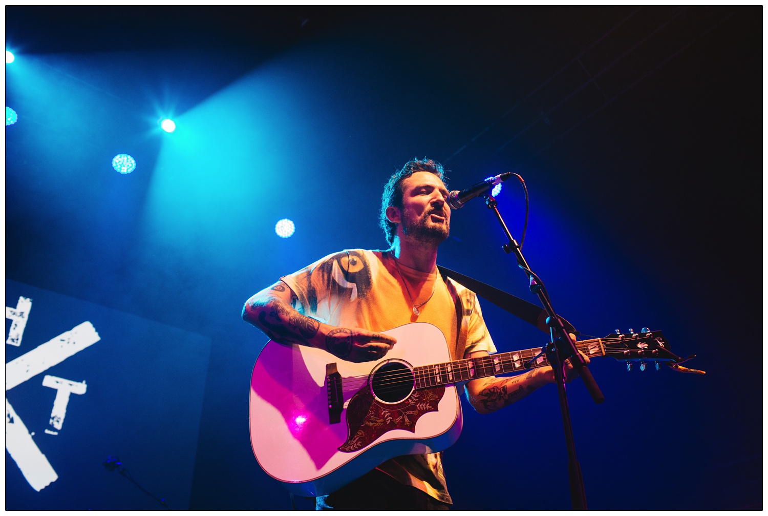 Frank Turner on stage performing at A Peaceful Noise