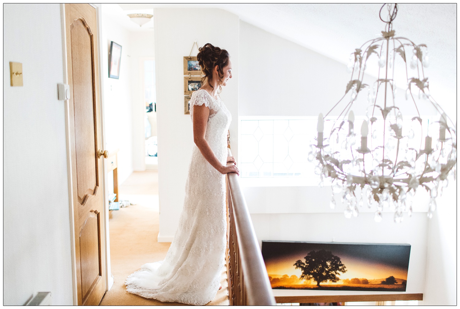 bride at home looking over the landing bannister