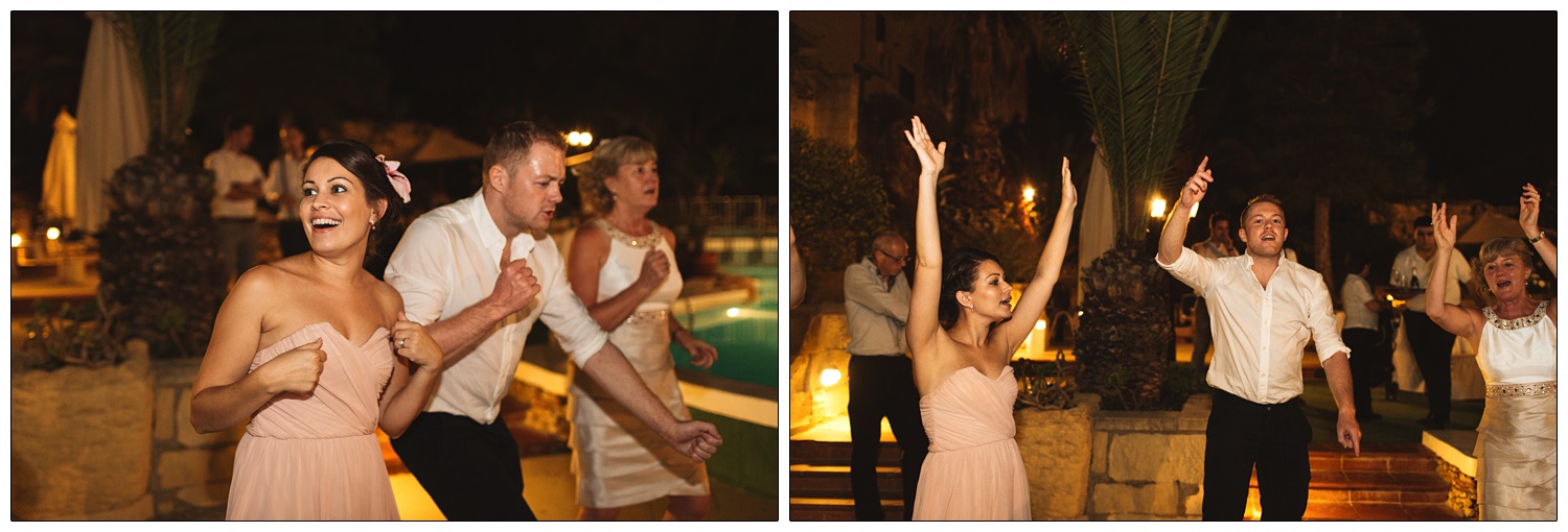bridesmaid in pink dress dancing at a destination wedding reception in Gozo