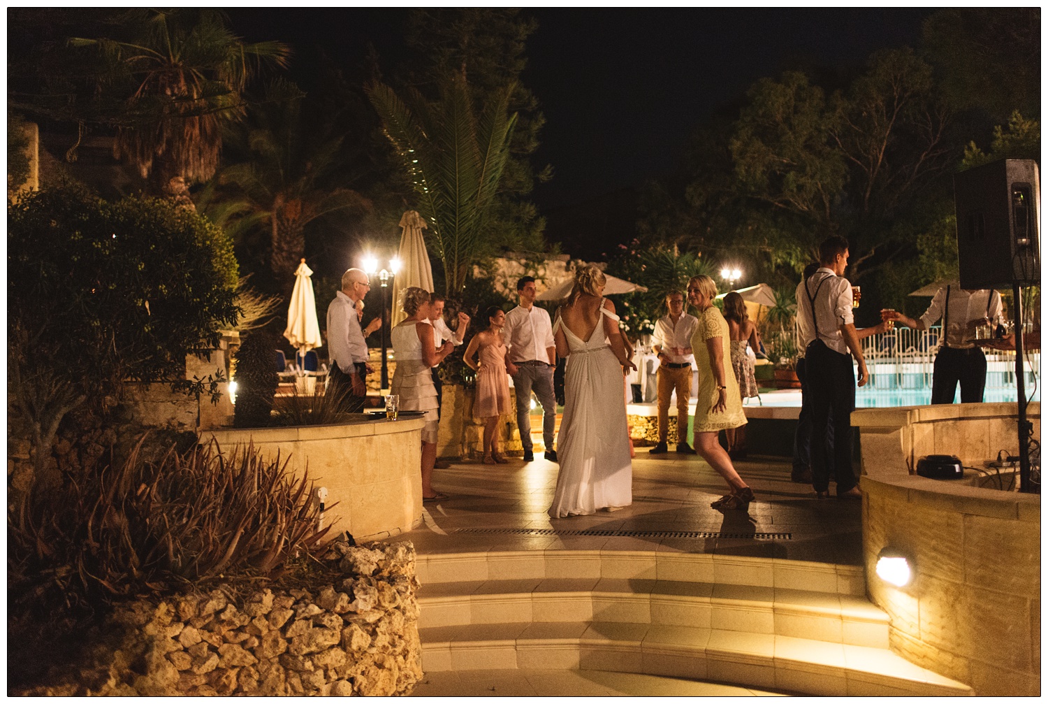 Wedding party by the swimming pool.