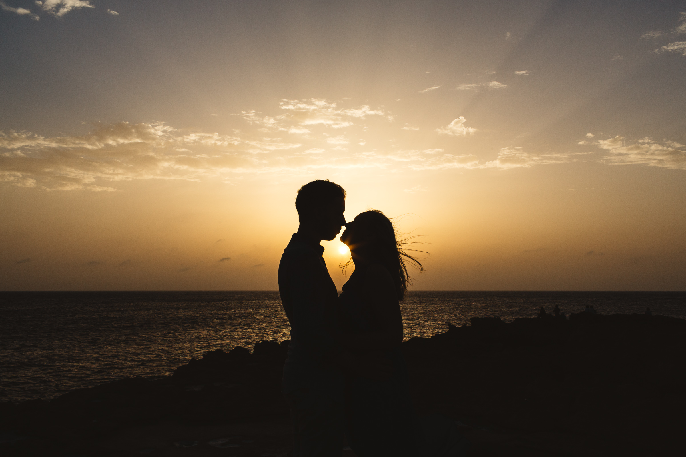 A silhouette sunset kiss in Gozo.