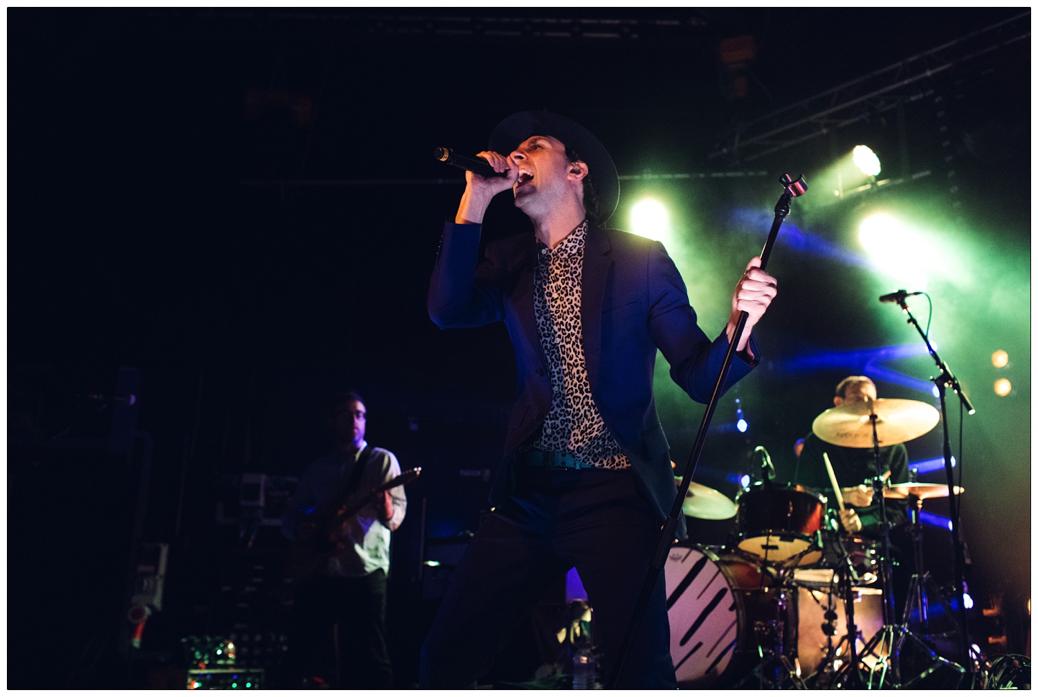 Paul Smith of Maxïmo Park holding the microphone stand.