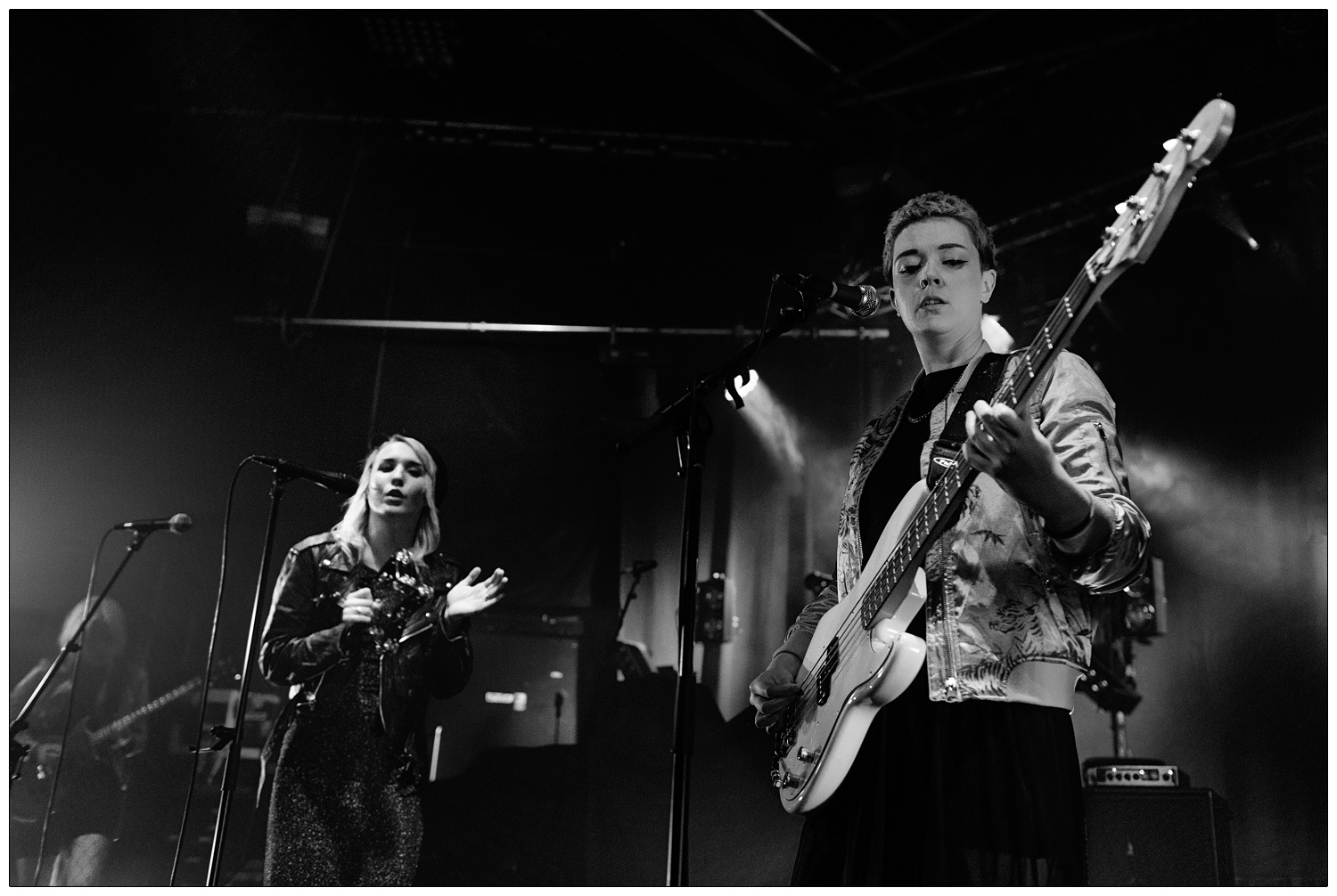 Anna Donigan on bass and Faith Vern playing the tambourine and singing in band PINS at the Cambridge Junction