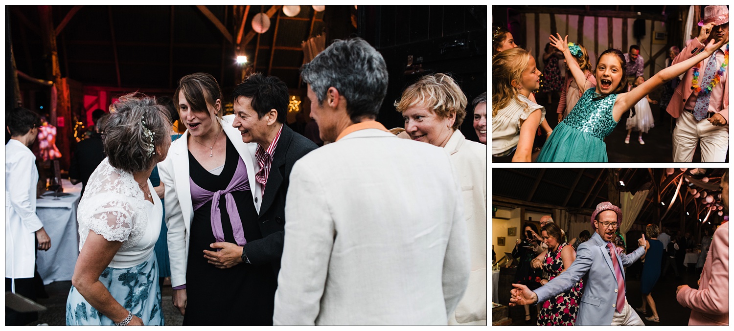 People dancing and chatting at an evening reception.