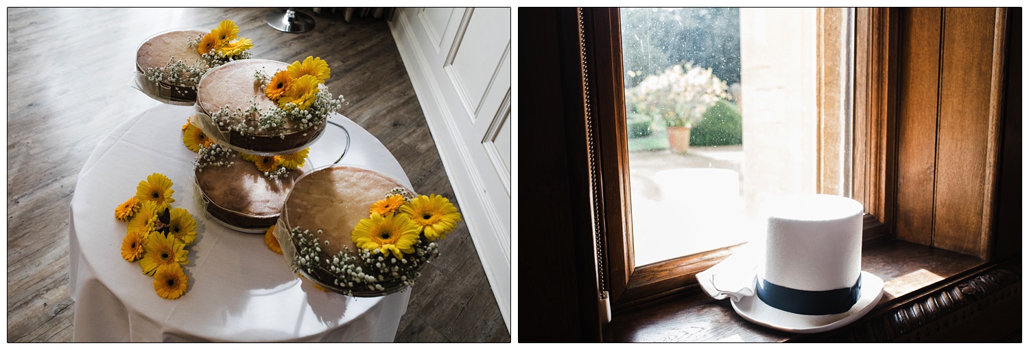 A white top hat on a windowsill. A wedding cake in four parts with yellow gerbera daisies.