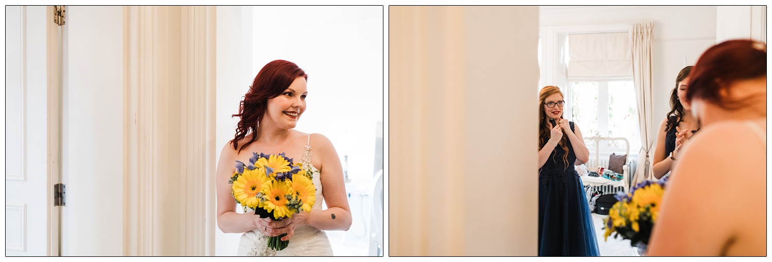 Woman holding yellow gerbera daisies, she has red hair and is wearing wedding dress.