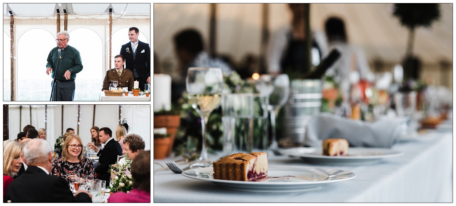 A cake on a plate on a table at a wedding breakfast. Wine glasses in the background.