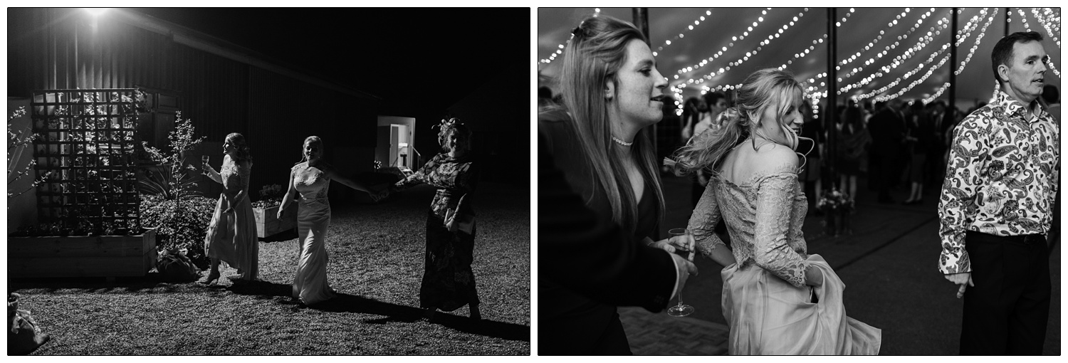 A bridesmaid dancing in a marquee decorated with fairy lights.