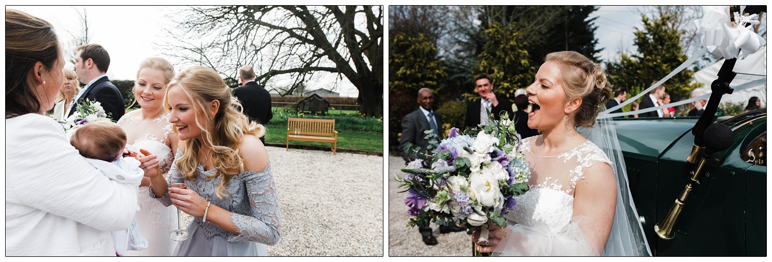 A bridesmaid in lilac is smiling at a baby.