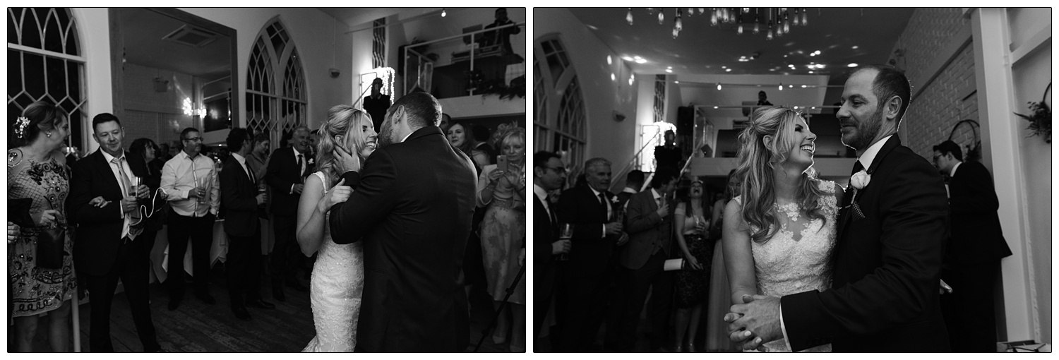 The first dance at a December wedding in Essex. The groom holds his wife's face, about to kiss her.