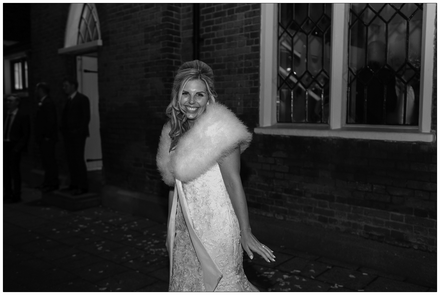 The bride at the end of the wedding day outside the Old Parish Rooms