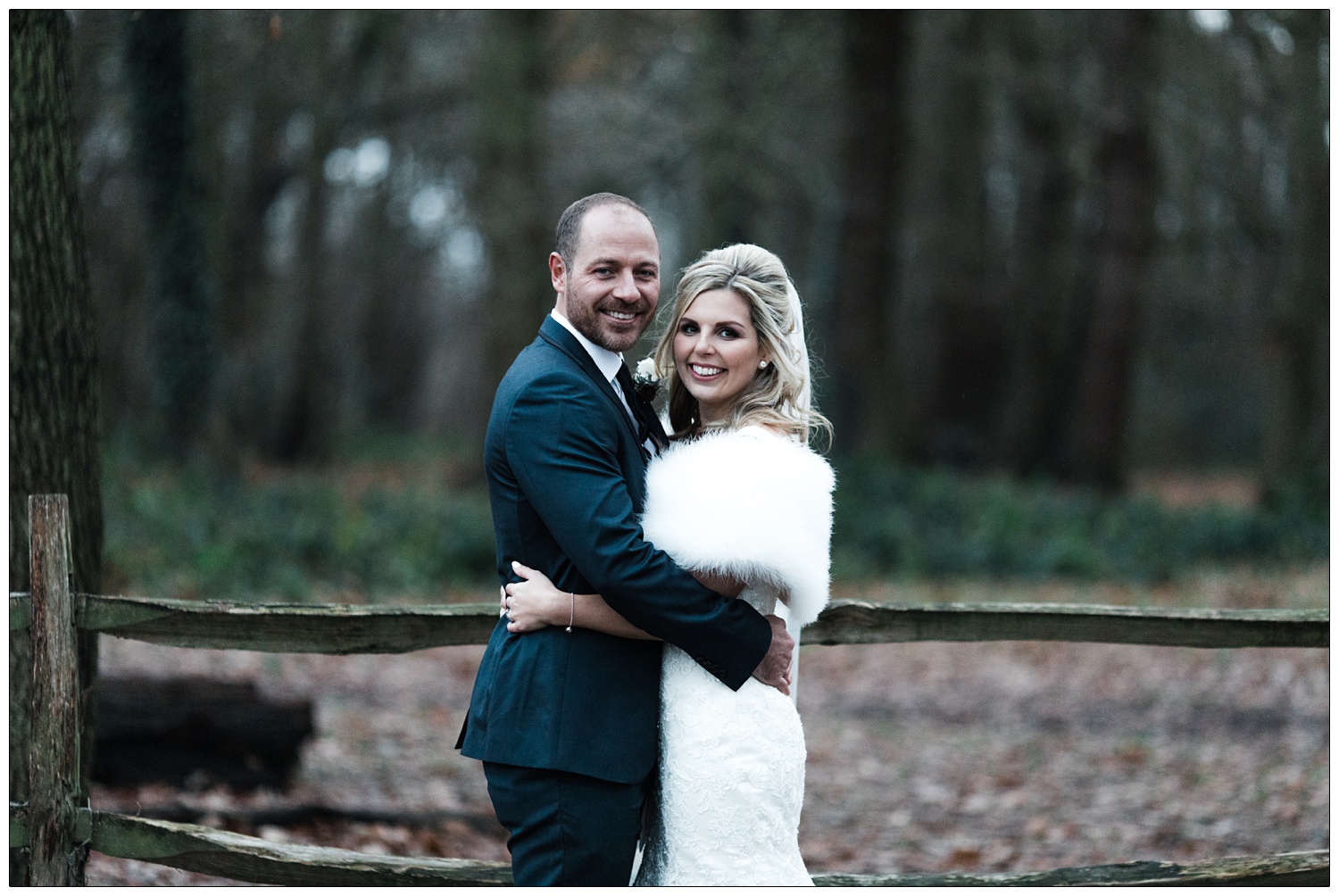 Newly married couple photographs in Hockley woods in December. It's starting to get dark.
