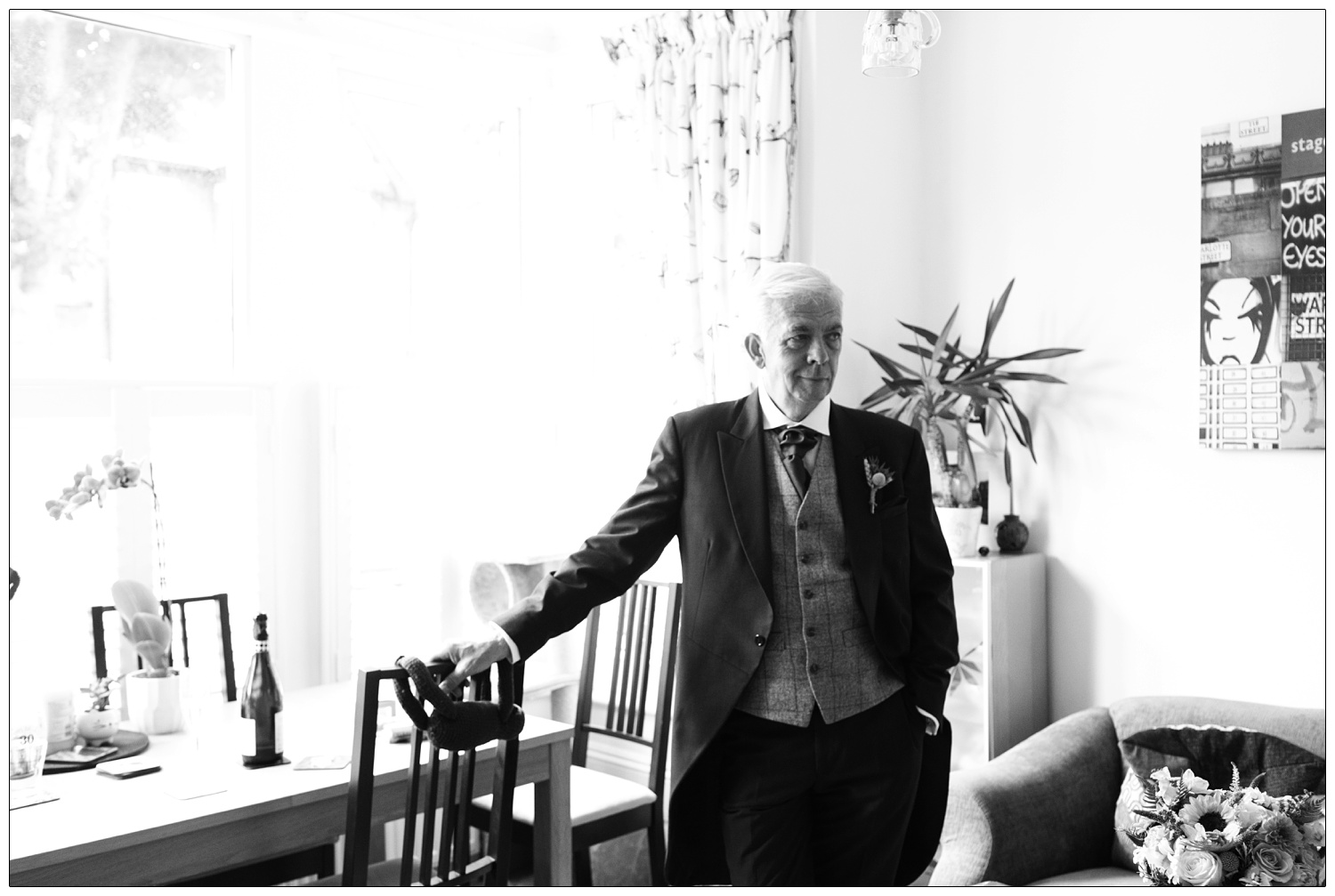 Father of the bride in his morning suit at his daughter's home before the wedding.