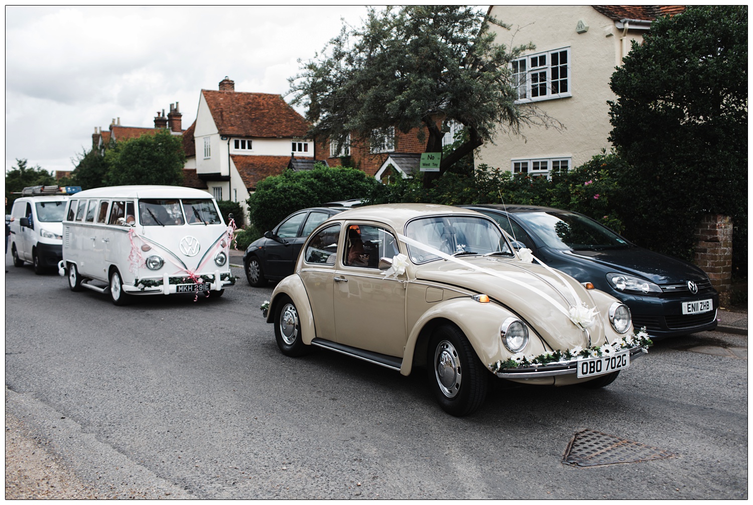 A beige 1968 Volkswagen Beetle and a 1967 white campervan taking the bride and bridesmaids to a wedding in Great Tey.