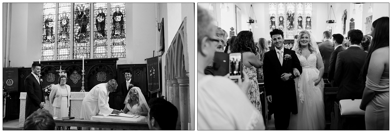 Man and woman walk down the aisle of St Barnabas Church.