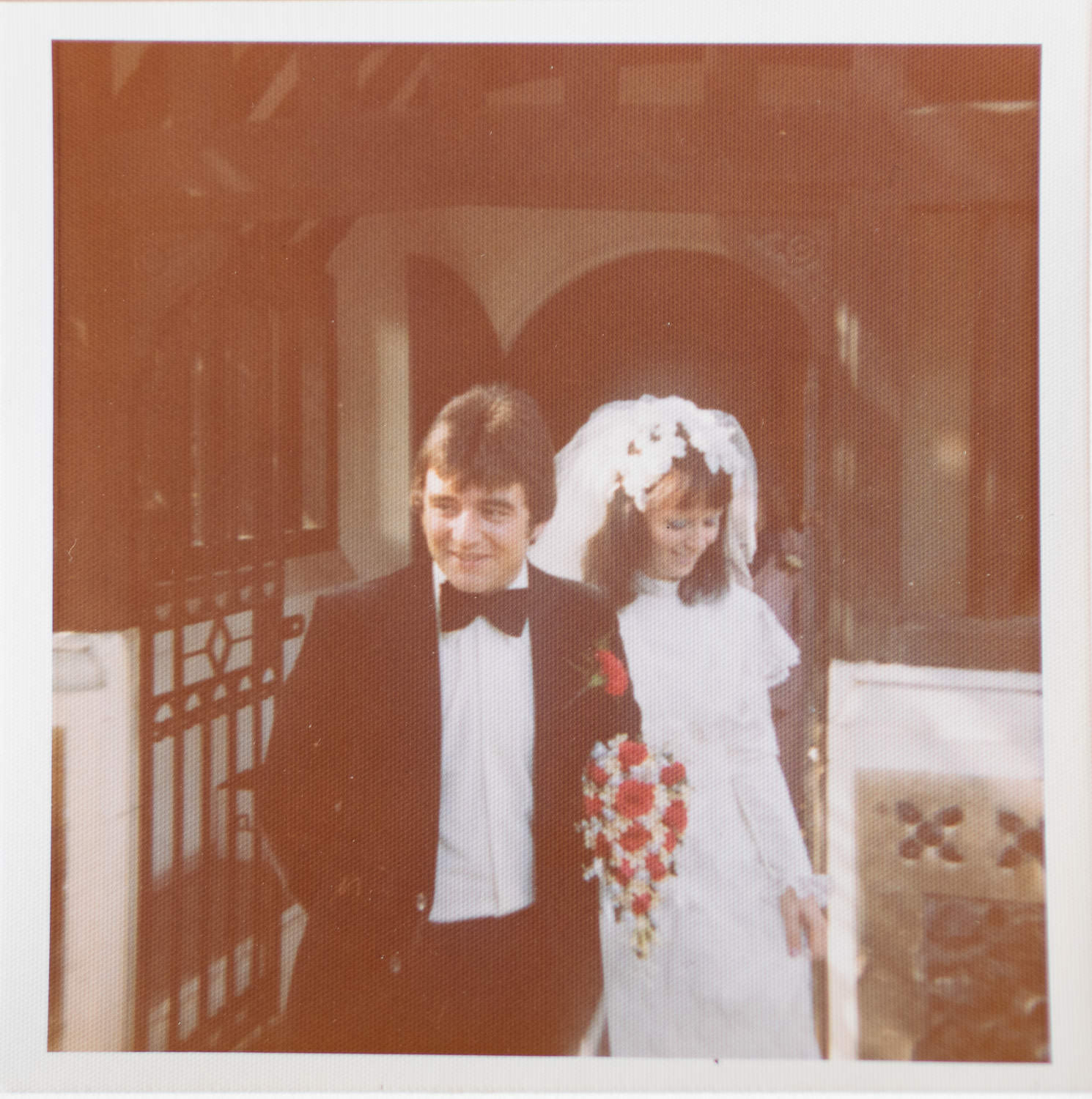 A groom and bride leaving the church of St Helen and St Giles in Rainham in 1975