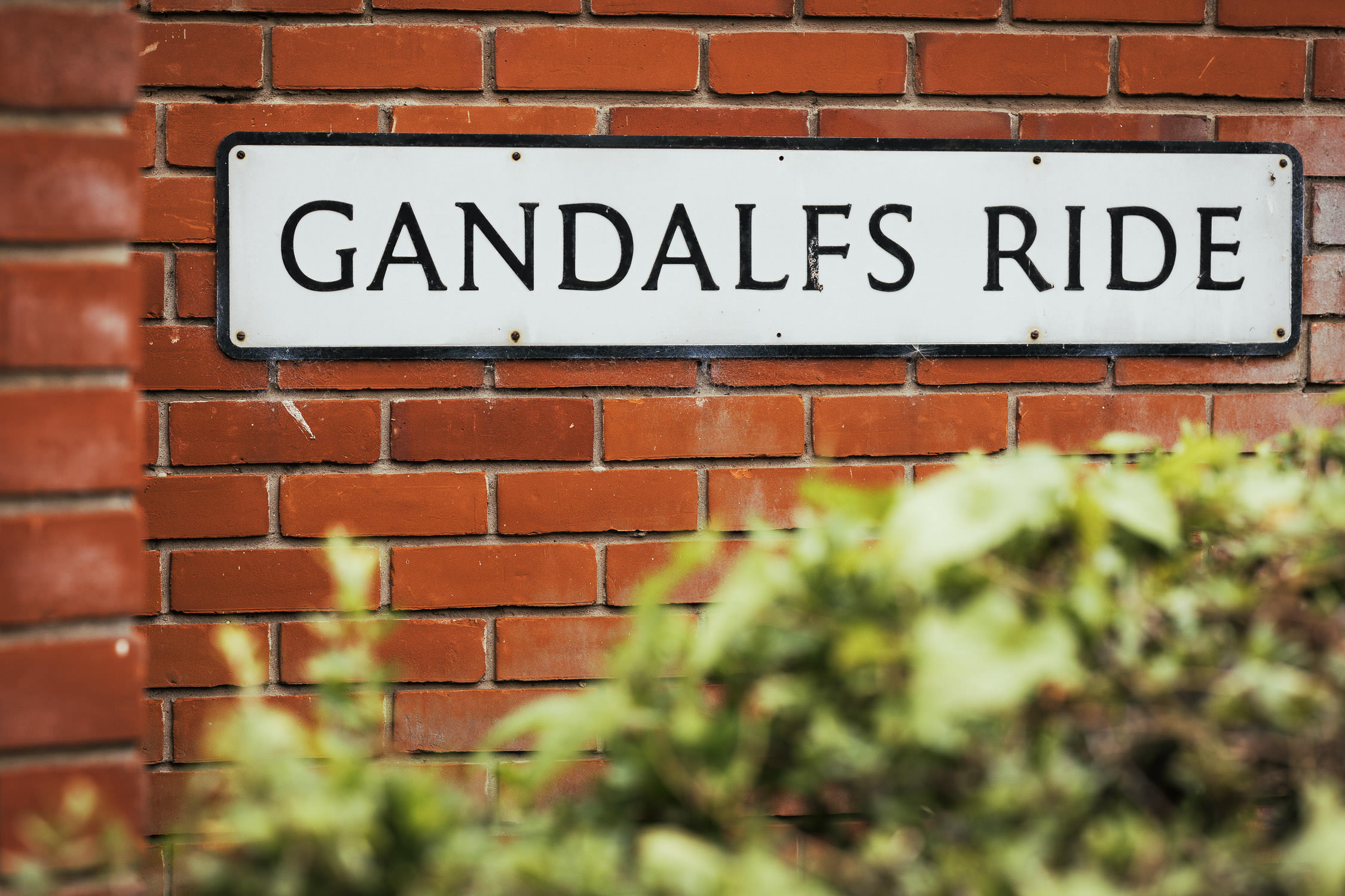 Gandalf's Ride street sign in South Woodham Ferrers near Chelmsford. The sign is on a wall of red bricks.