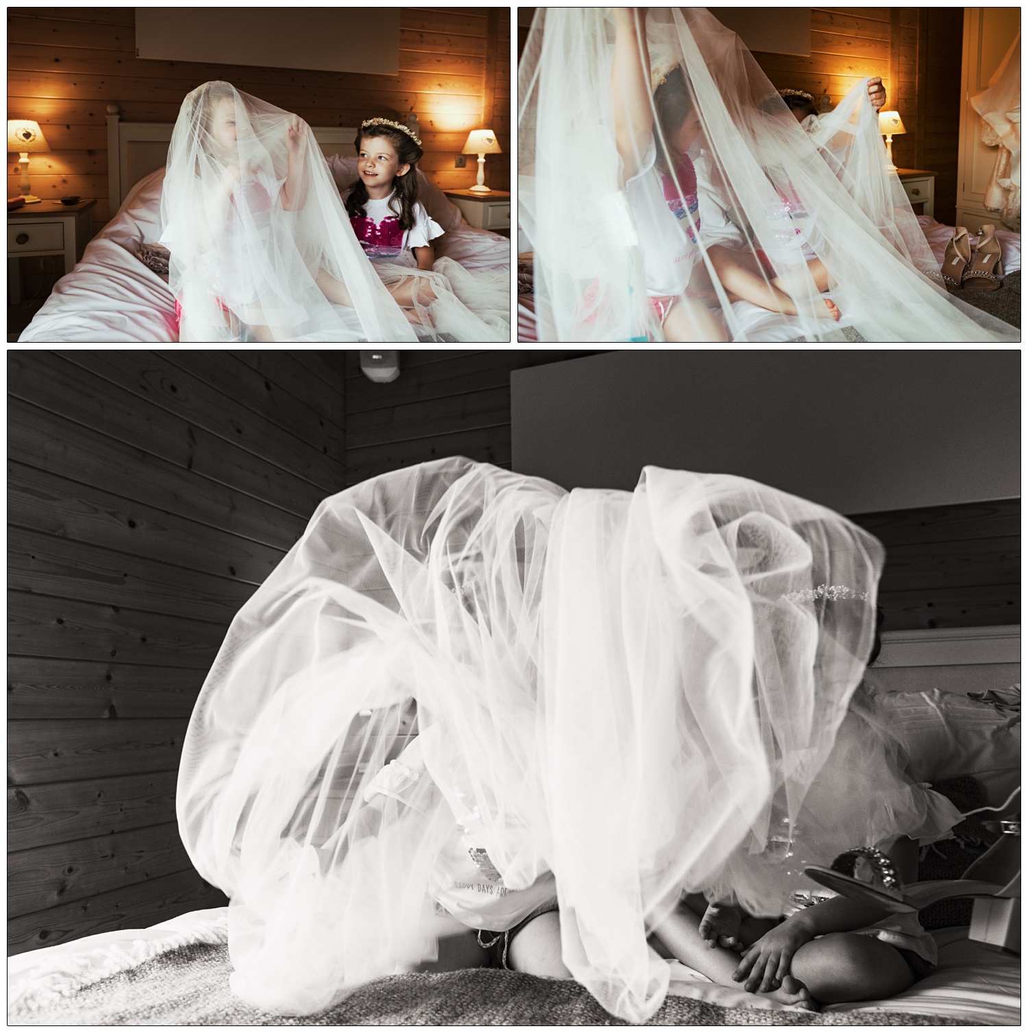 Two children sitting on a bed are playing with a bridal veil. Hiding underneath it.